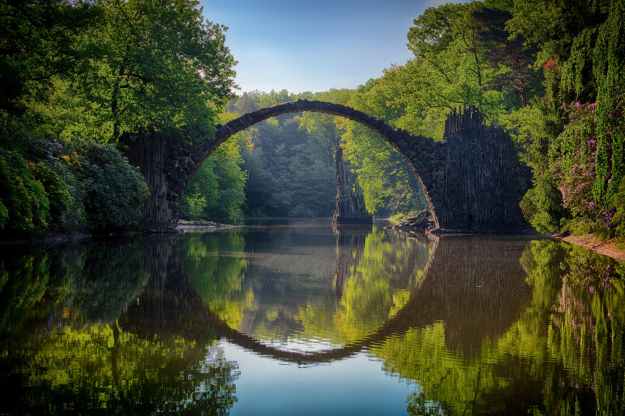 gray bridge and trees
